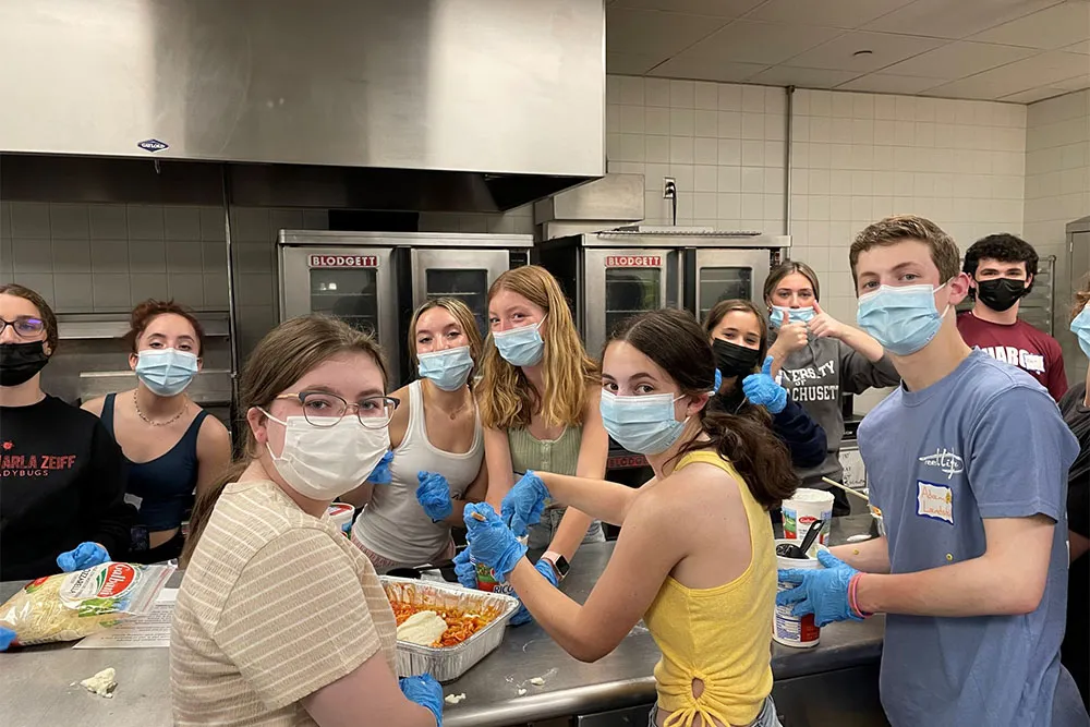 grow of kids from USY doing volunteer work in a kitchen