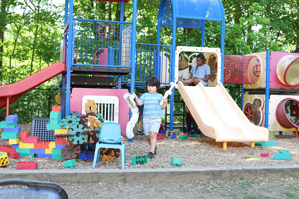 kids playing on a play place outside