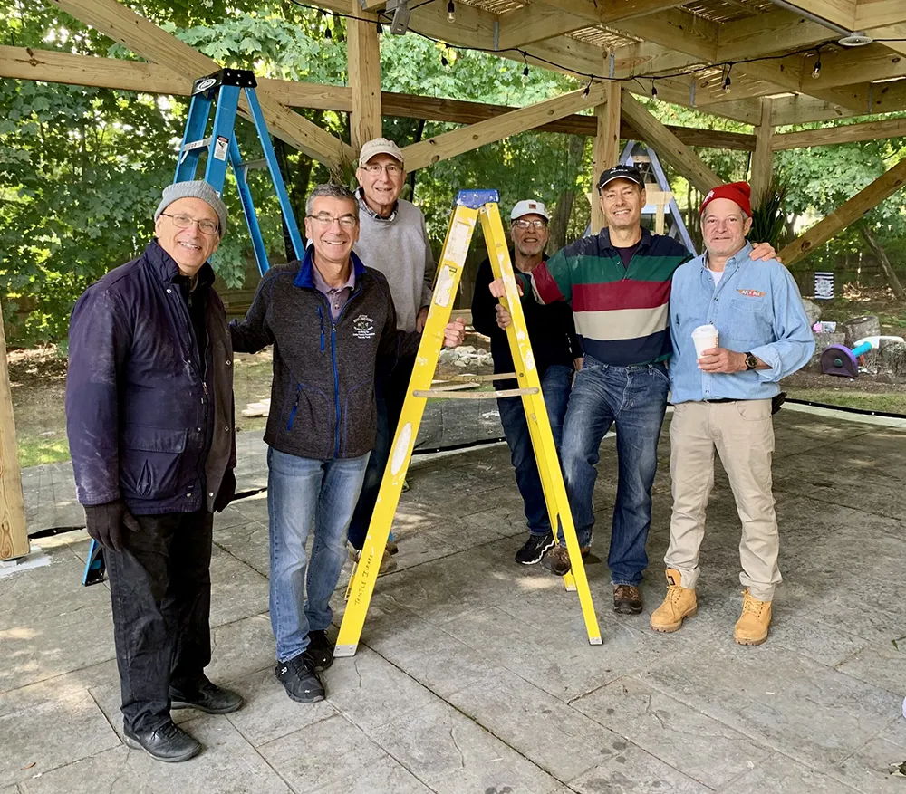 group of men posing ready to work